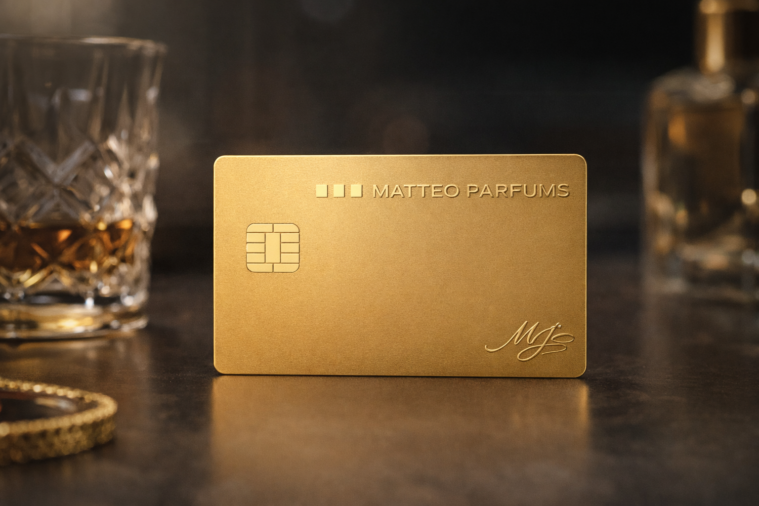 Gold card with 'Matteo Parfums' branding on a dark surface with a glass of whiskey and perfume bottle.