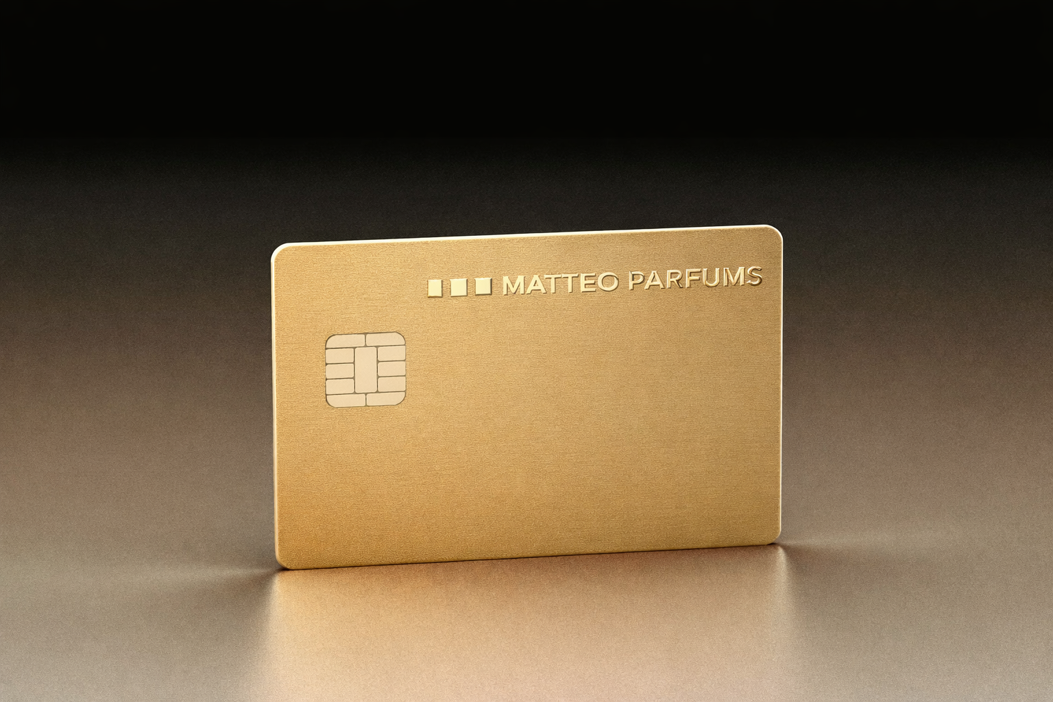 Gold card with 'MATTEO PARFUMS' branding on a reflecting silver surface and dark background